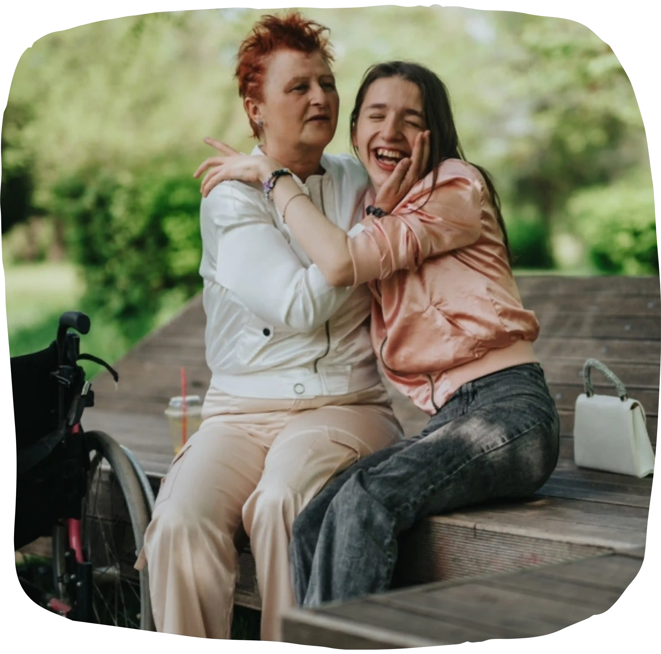 Support worker hugging disabled girl